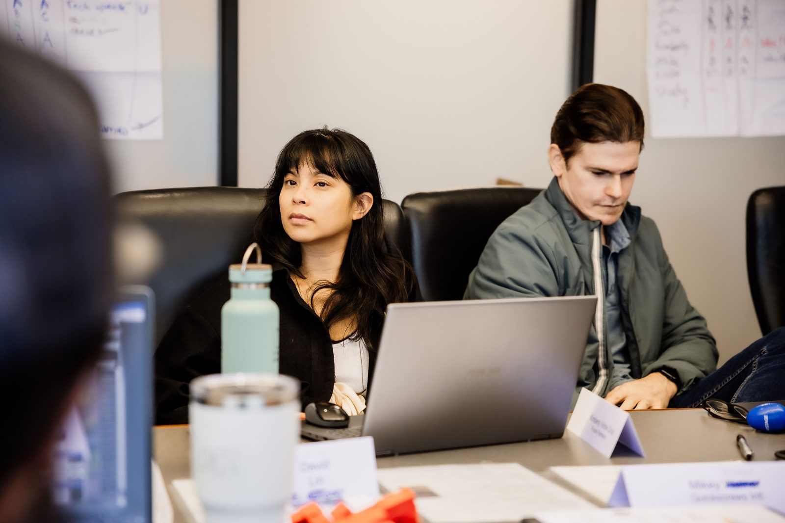Colleagues working through a problem in a client session