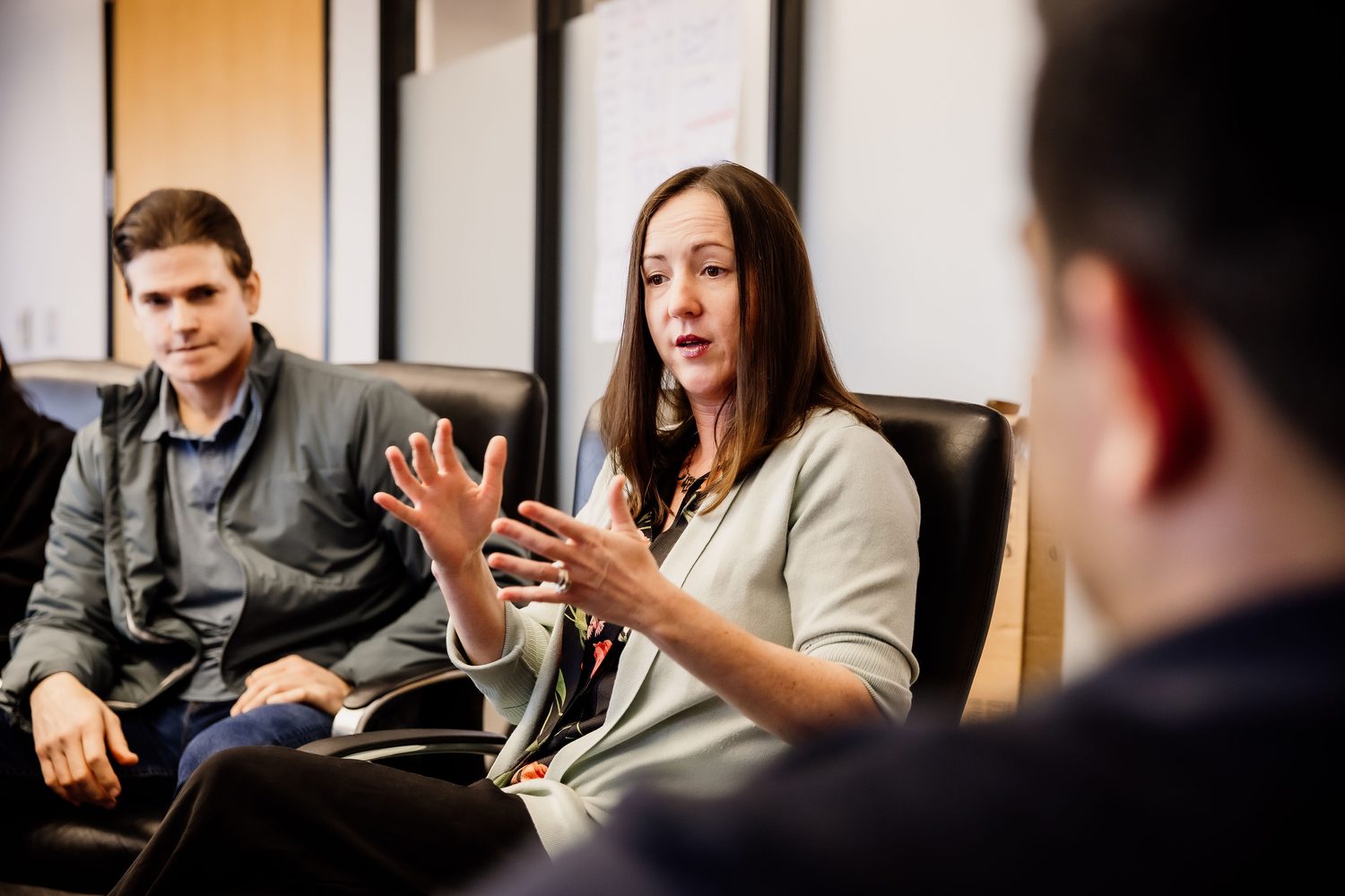 Colleagues working through a position in a client session